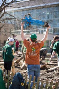 Students smash plastic snakes as part of the St. Pat's tradition