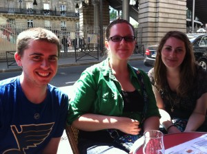 James, Courtney, and Courtney relax at a café