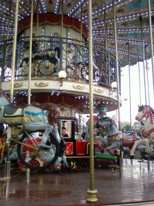 The carousal next to the Eiffel Tower is two stories with a curved staircase. Some of the horses also have bike pedals attached for no reason other that to pedal while riding.