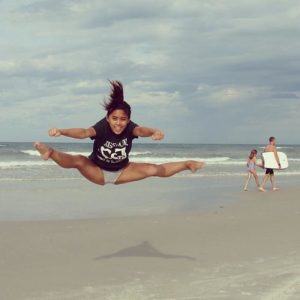Frances Manahan practices her cheerleading technique over the summer while visiting New Smyrna Beach, Fla. She was one of more than 20 people to take part in the #MinerNation Instagram contest.