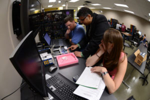 Students in the Missouri S&T-Missouri State Cooperative Engineering Program work with Dr. Rohit Dua, center, assistant teaching professor of electrical engineering, in a lab at the Plaster Center in Springfield, Mo.
