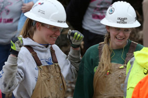 Lindsay Miller (left) reacts to the results of Deanna Fitzergerald’s effort in the jackleg drilling event on Friday, April 4.