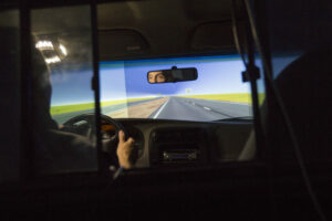Missouri Highway Traffic Safety engineer John Miller "drives" the Missouri S&T Driving Simulator. Missouri S&T researchers are studying alternate work zone signage. 