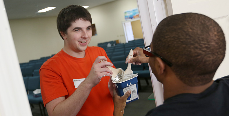 Service learning is one of the many ways Missouri S&T students can earn experiential learning credit. Student Adam Kochan, left, volunteers to paint the interior of the New Dimensional Christian Ministry in Rolla during last January's Martin Luther King Jr. Day of Service.