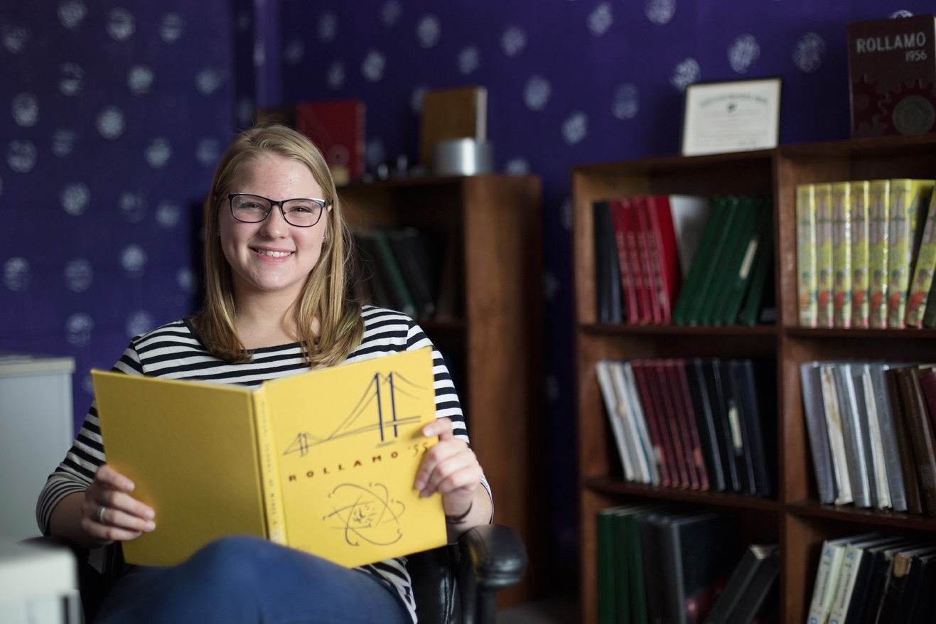 Tegan Brand skims the 1955 Rollamo yearbook. Sam O'Keefe/Missouri S&T