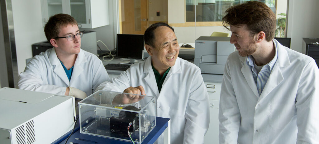 Ma works with Burton (right) and undergraduate student Alex Cristea (left) on Ma's P-scan cancer-screening device. Photo by Sam O'Keefe/Missouri S&T