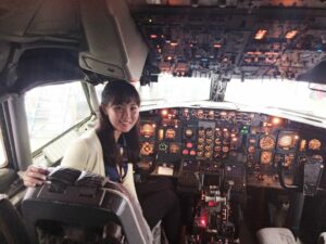 Yeon Kyung Lee on the flight deck of a Southwest airplane. Photo provided by Campus Reach – Southwest Airlines.