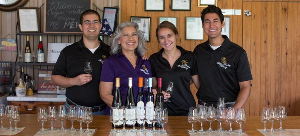 Patrick Martin (from left), Esther Martin, Anna Wallace and Derek Martin pose with Martin Brothers Winery's mead offerings at the meadery's guided tasting bar outside of Hermann, Missouri.