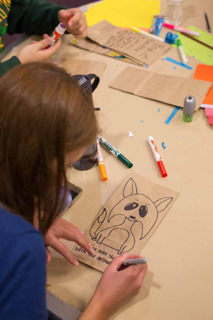 0235 Missouri S&T students decorates lunch sacks for Rolla’s Meals on Wheels program, which delivers food to local senior citizens.