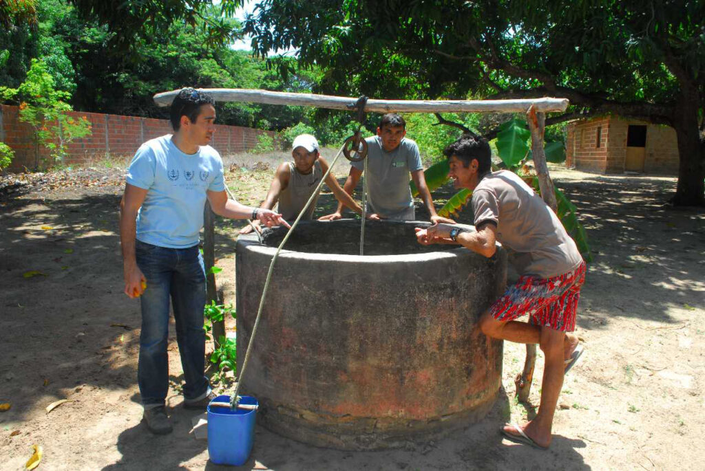 S&T students work with locals on a water well in Guatemala.
