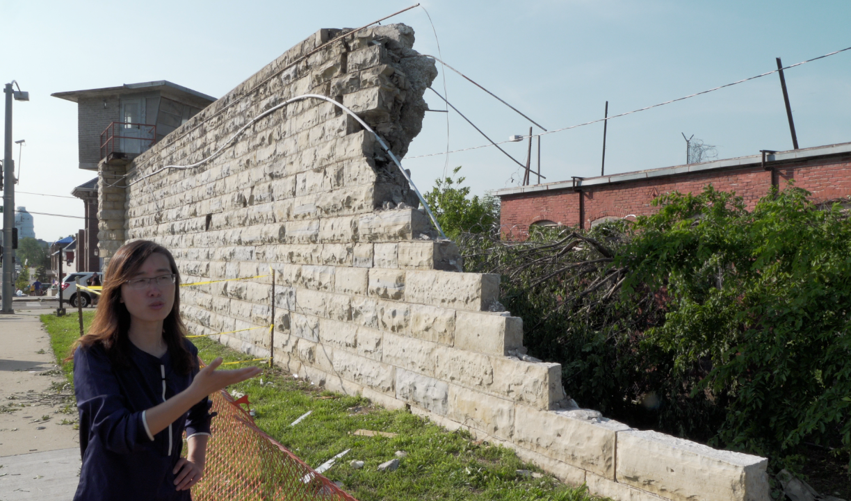 Dr. Guirong (Grace) Yan inspects the wall of the former Missouri State Penitentiary, which was damaged by the tornado that struck Jefferson City, Missouri, on May 22, 2019. Photo by Terry Barner/Missouri S&T.