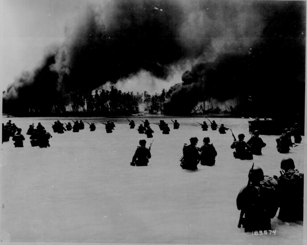 The U.S. Army's 165th Infantry Regiment, 27th Infantry Division, invading Butaritari, the main island of the Makin Atoll in November 1943. National Archives photo.