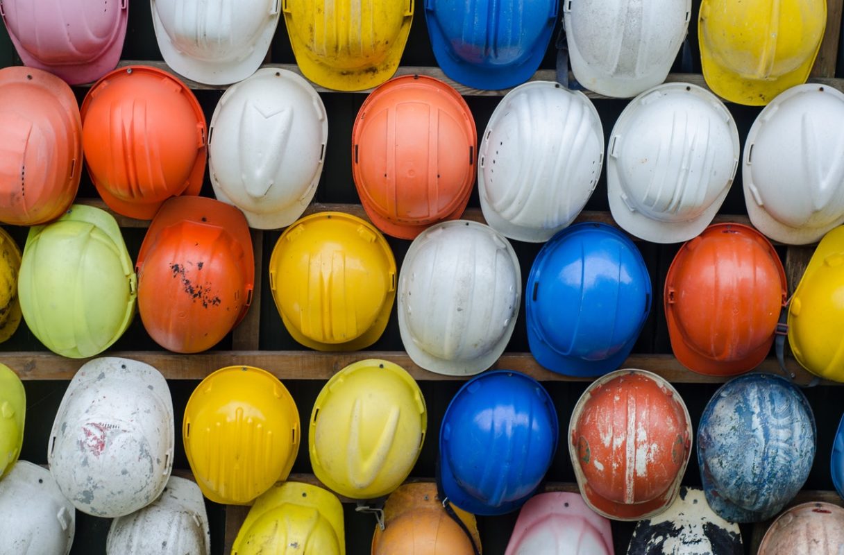 collection of colorful safety helmets