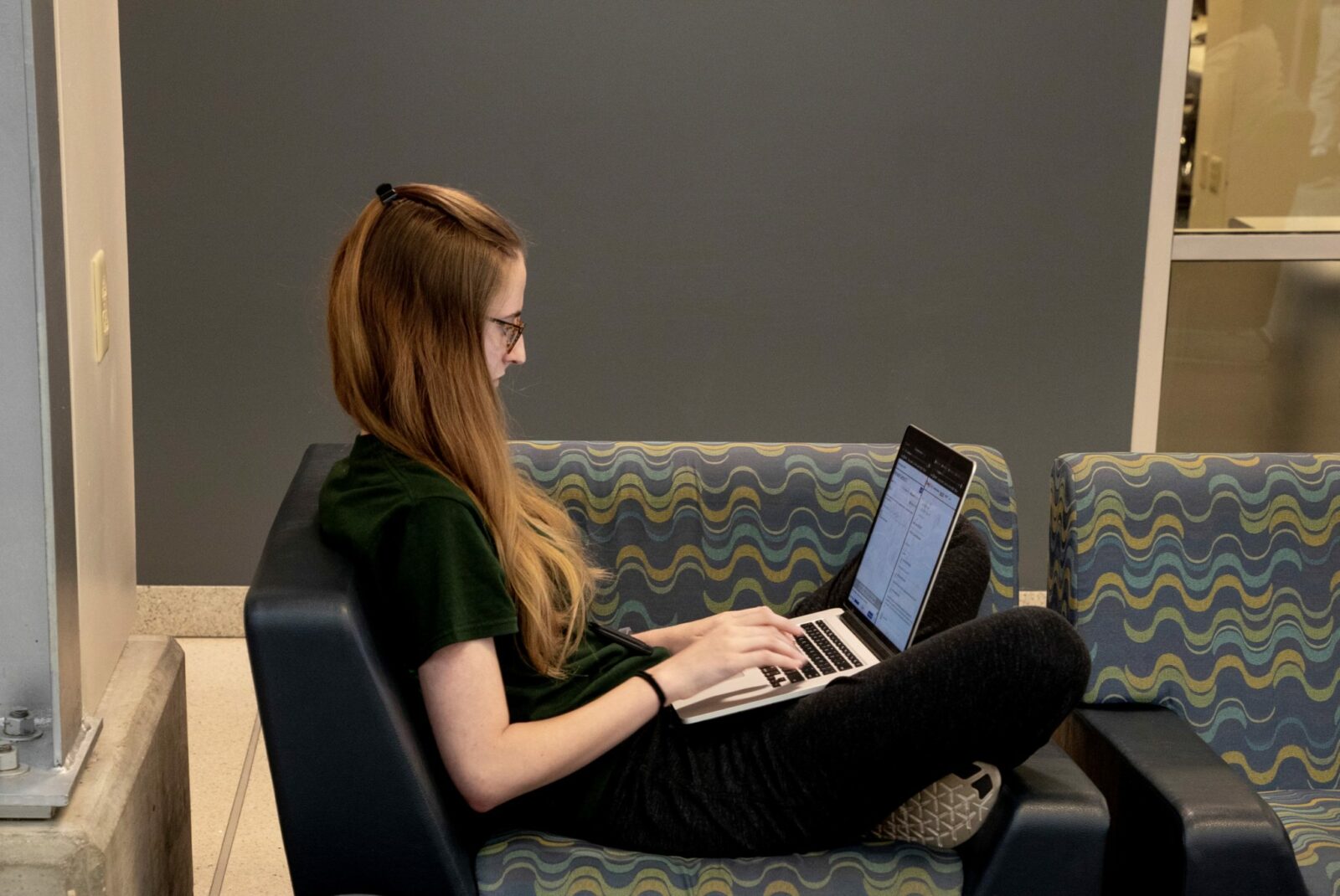 Female student working on laptop computer