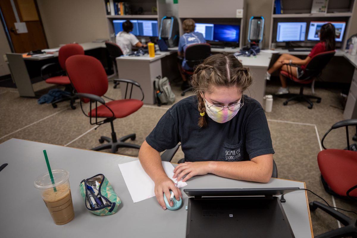 Students reviewing case study for American Society for Engineering Management competition