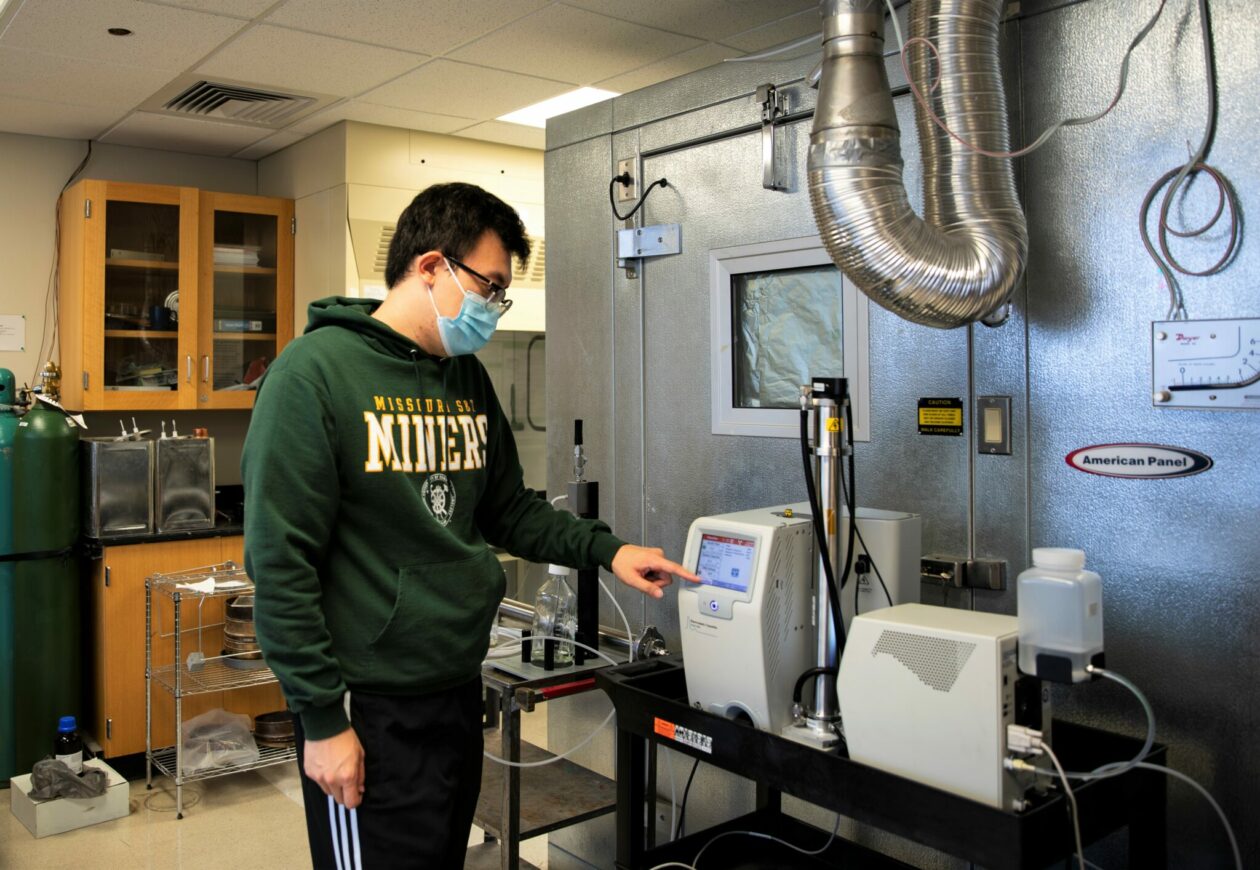 Photo of Ph.D. student Weixing Hao working at the lab used to study bioaerosols