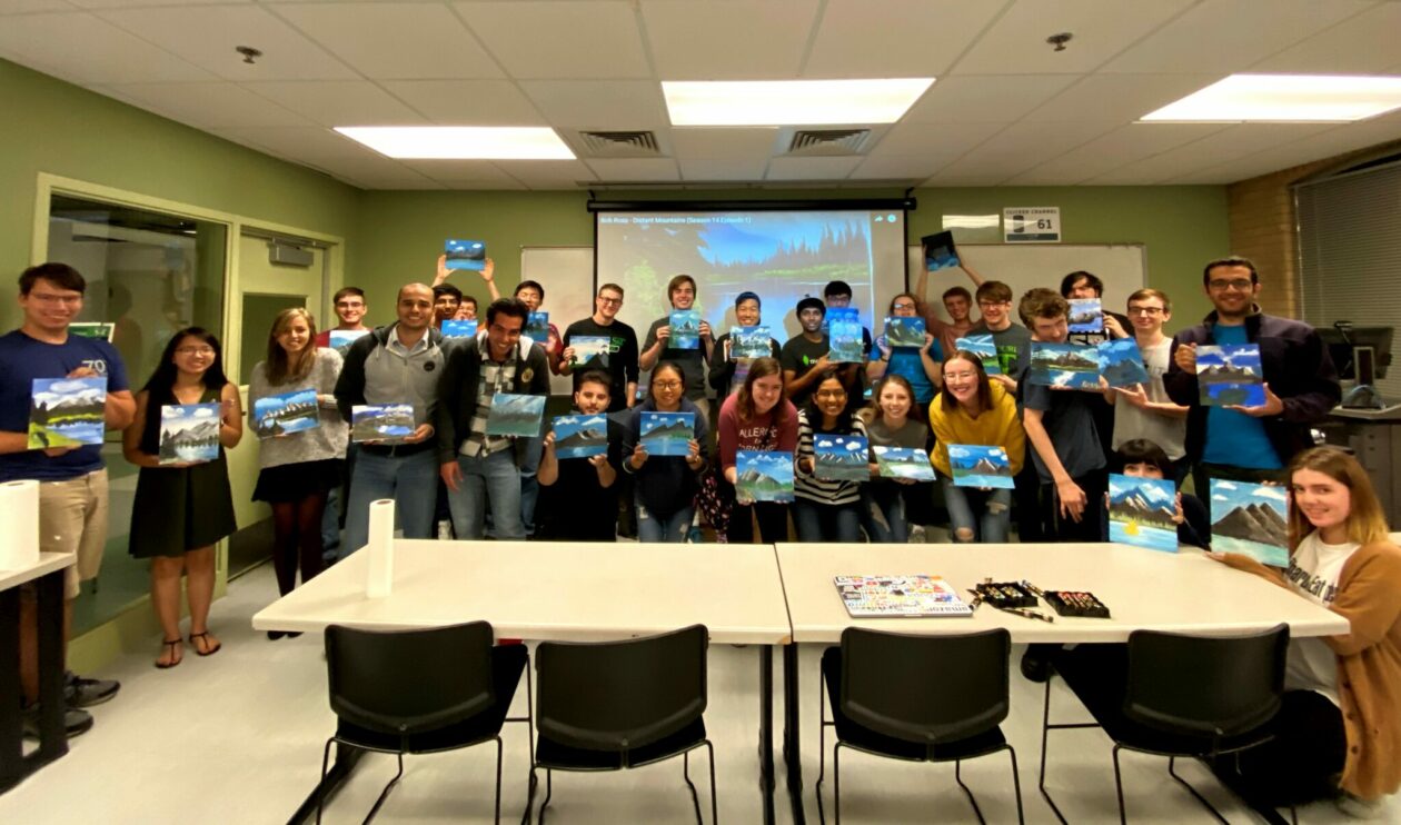 Photo of ACM students on a Bob Ross painting night