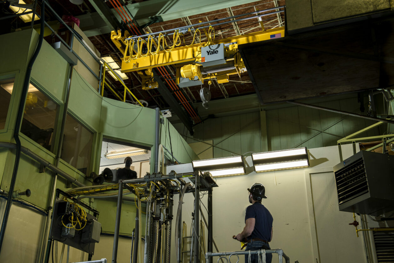 Photo of nuclear engineering students with new crane