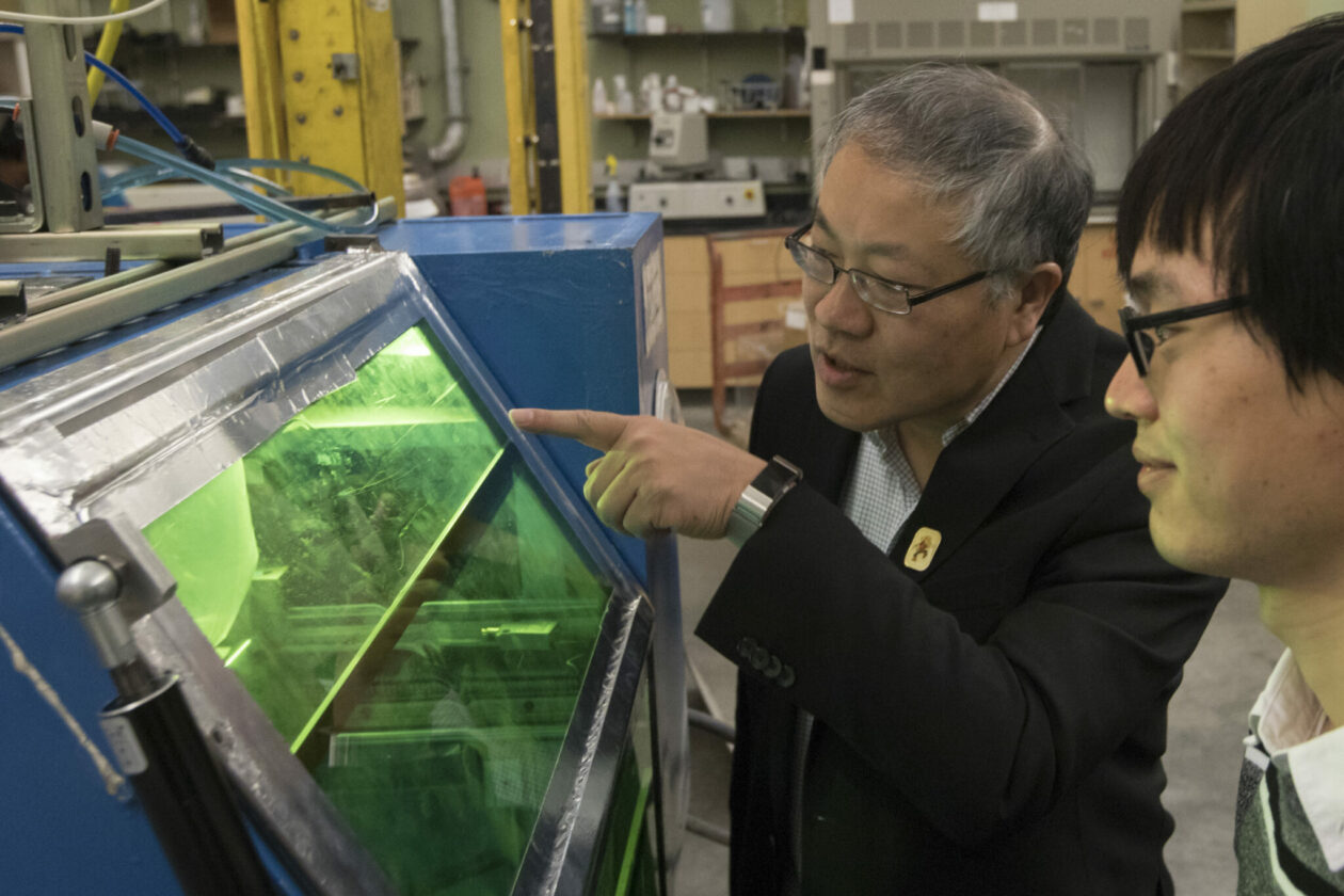 Dr. Frank Liou with student in lab