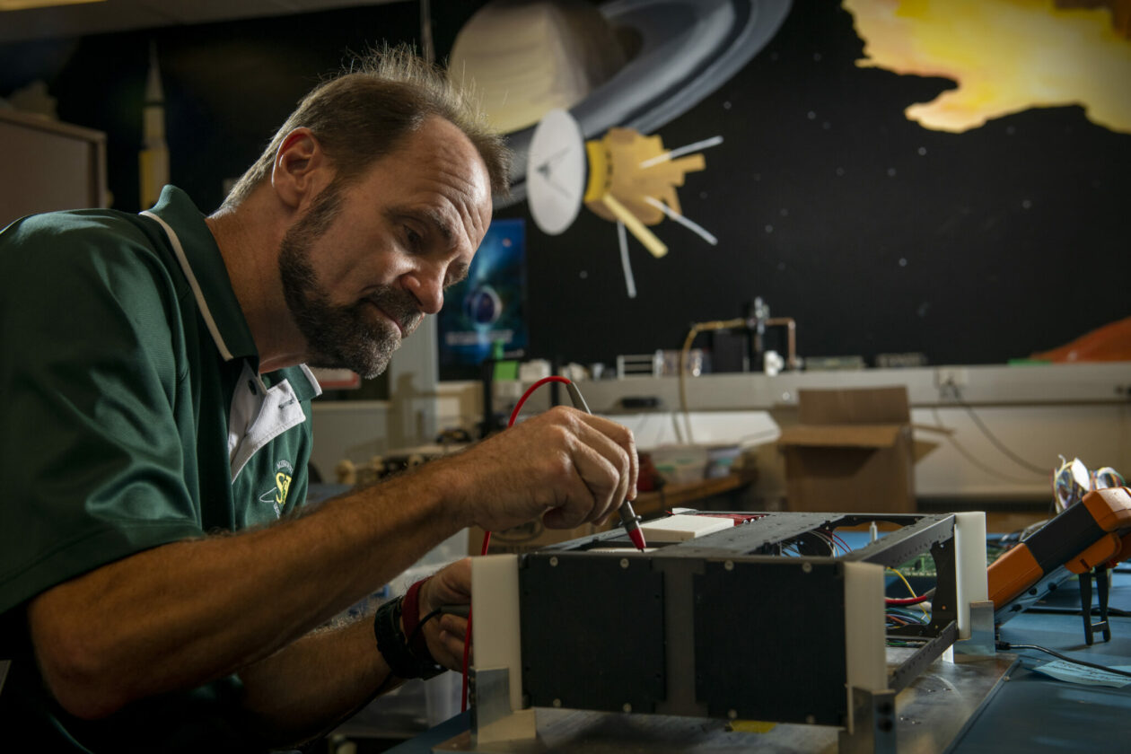 Photo of Dr. Henry Pernicka in satellite lab