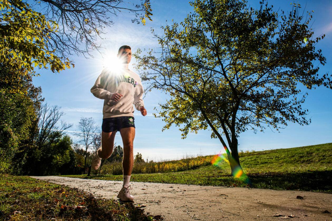 Ean Buffington running on a path