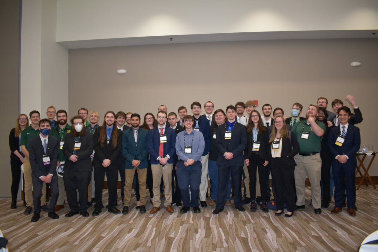 Two rows of students smiling for camera