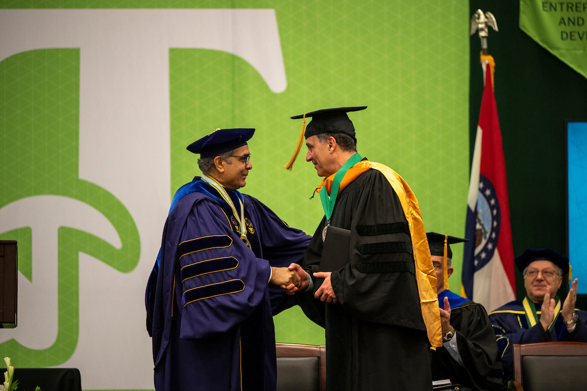John Wagner shakes chancellor's hand