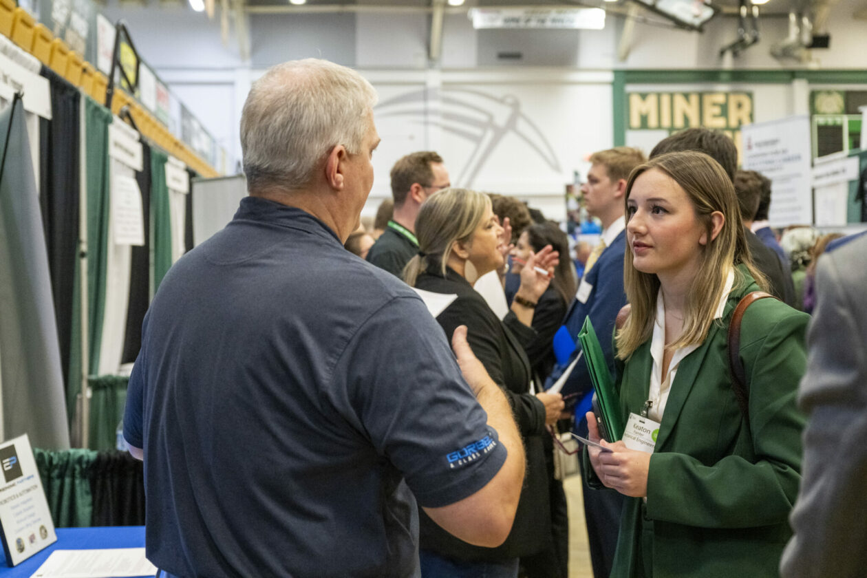 Career fair participants. Student and recruiter.