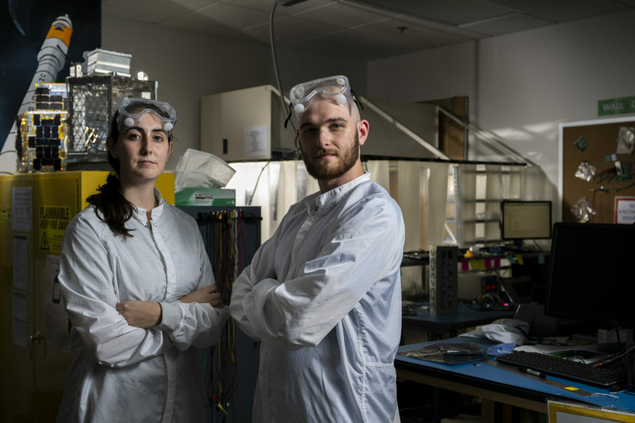 Emily Doddemeade, left, is the Multi-Mode Mission’s project manager, and Drake Beaman is the chief engineer. They are pictured here working in an S&T clean room. Photo by Michael Pierce/Missouri S&T.