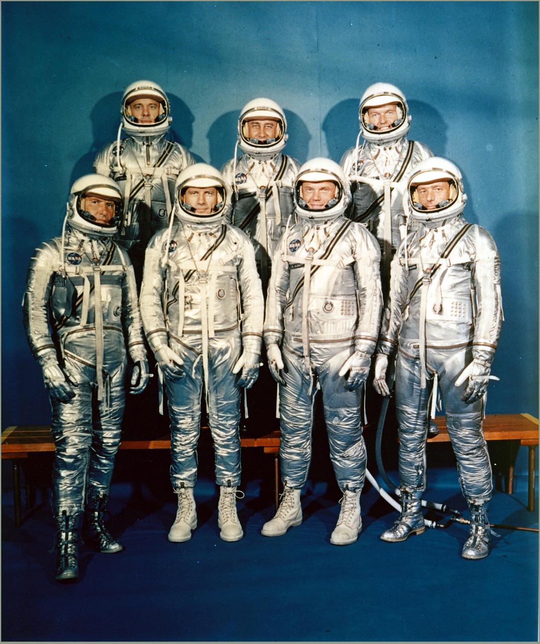 The Mercury Seven astronauts pose for a photo in their space suits.