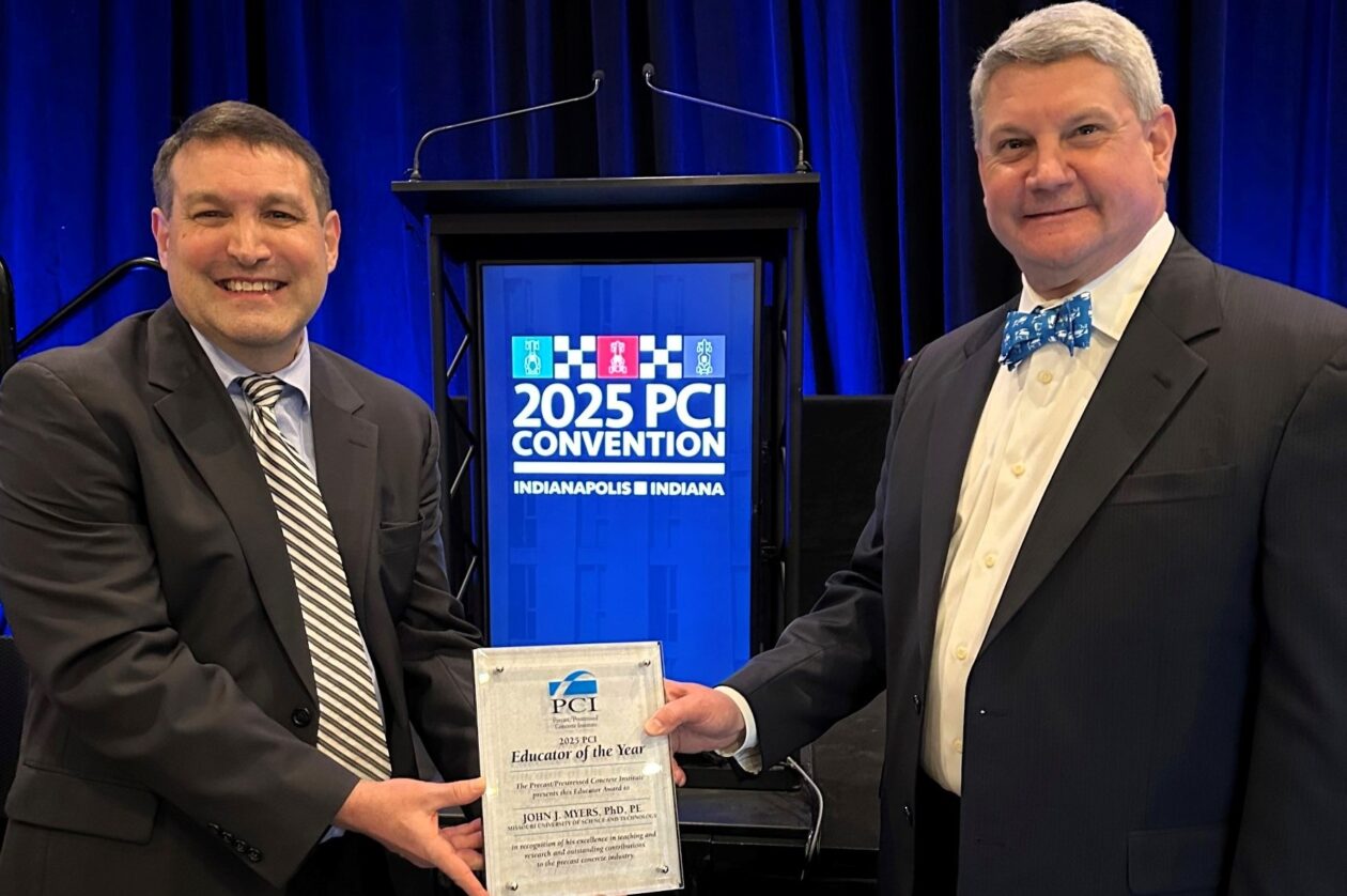 Dr. John J. Myers, left, accepts the award from Bob Risser, president and CEO of the Precast/Prestressed Concrete Institute. Photo courtesy of Myers.