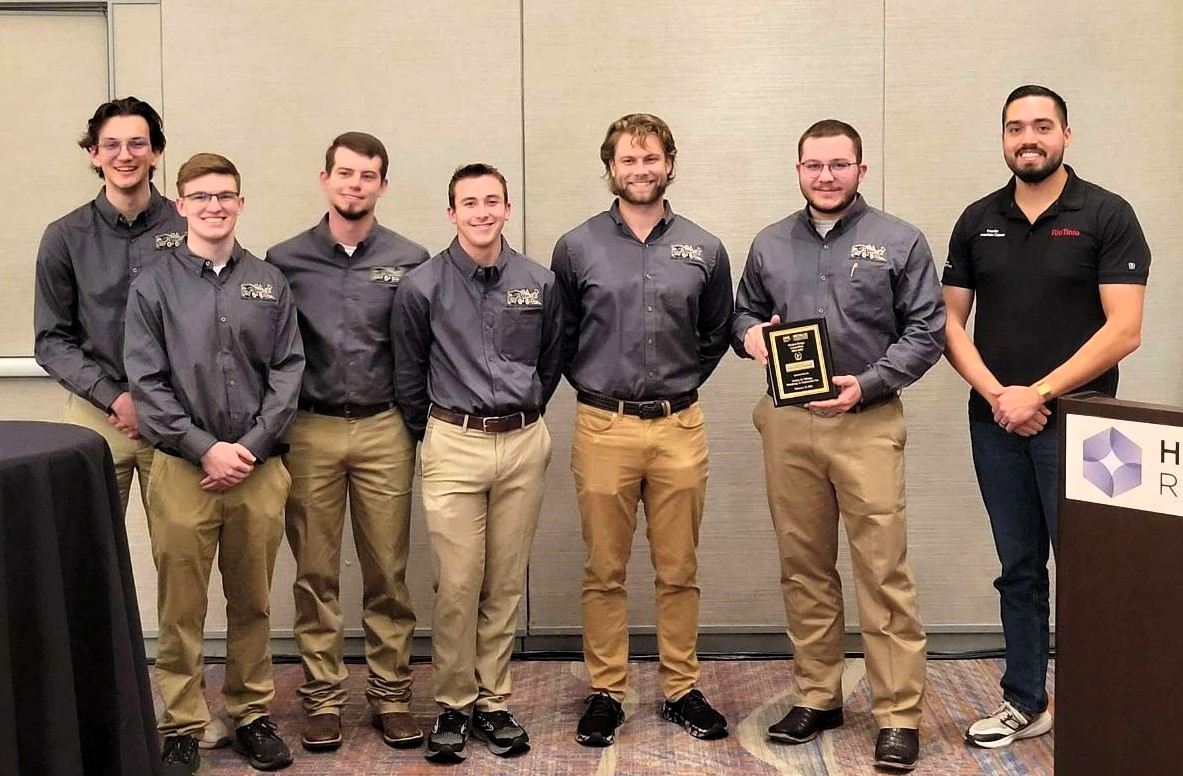 Members of the team include, from left, Ayden Yahn, Evan Barth, Toby Lonning, Thomas Barnes, Patrick Hatfield and Garrett Bell. They are joined by Miguel Pugmire, a senior mining engineer with Rio Tinto. Photo courtesy of Bell.