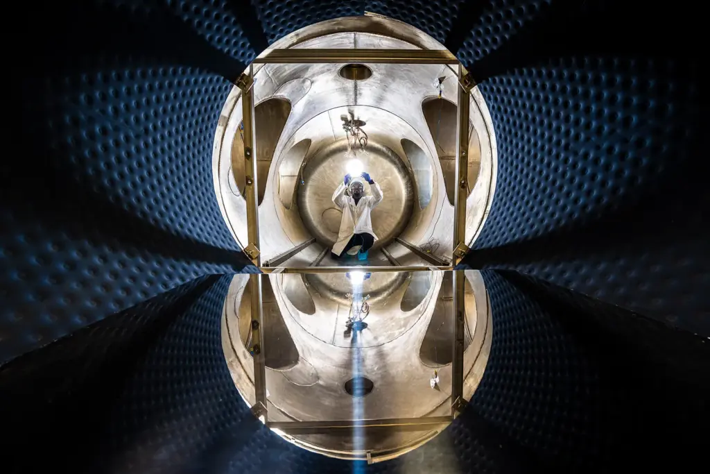 Man in vacuum chamber with light