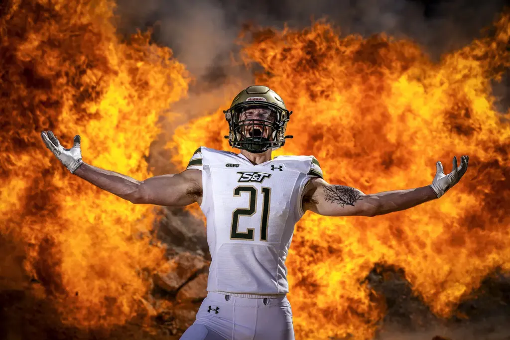 Football player in front of fireball