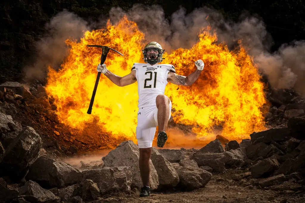 Football player in front of fireball