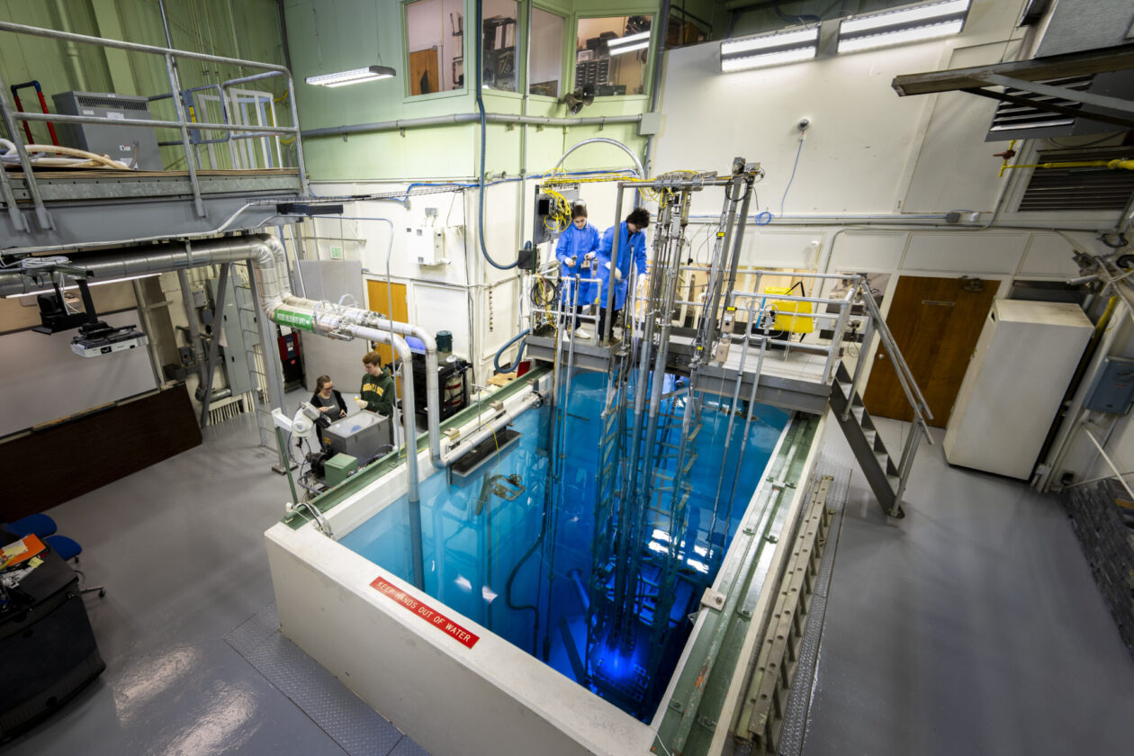 The Missouri S&T nuclear reactor glows blue with Cherenkov radiation from high-energy electrons moving faster than light in water. Photo by Michael Pierce/Missouri S&T.
