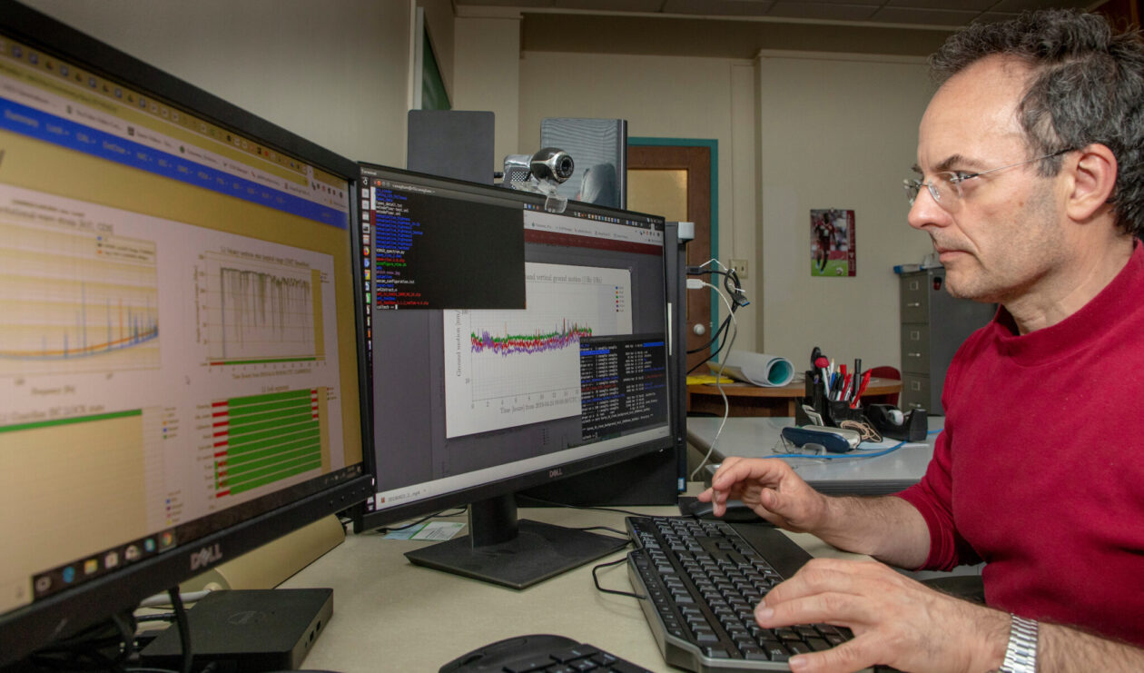 Dr. Marco Cavaglia looking at computer.