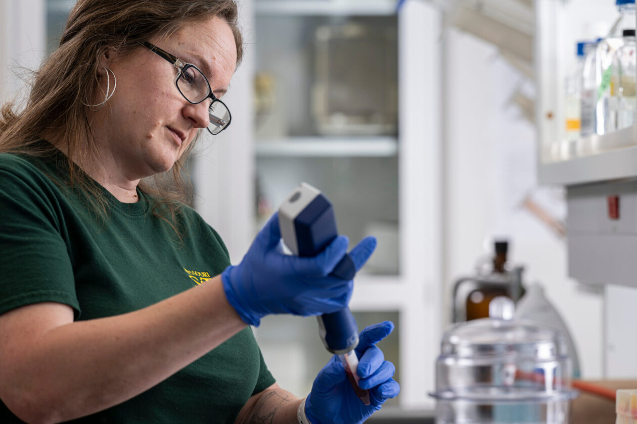 Harrell working in a laboratory.